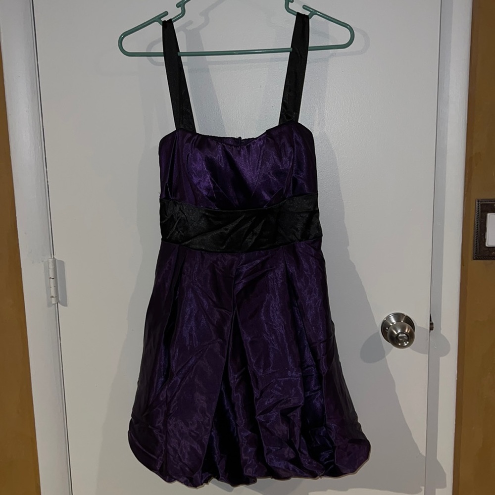 Purple dress with black straps and bow. Size 9